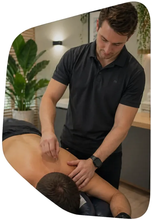 Massage therapist treating a patient